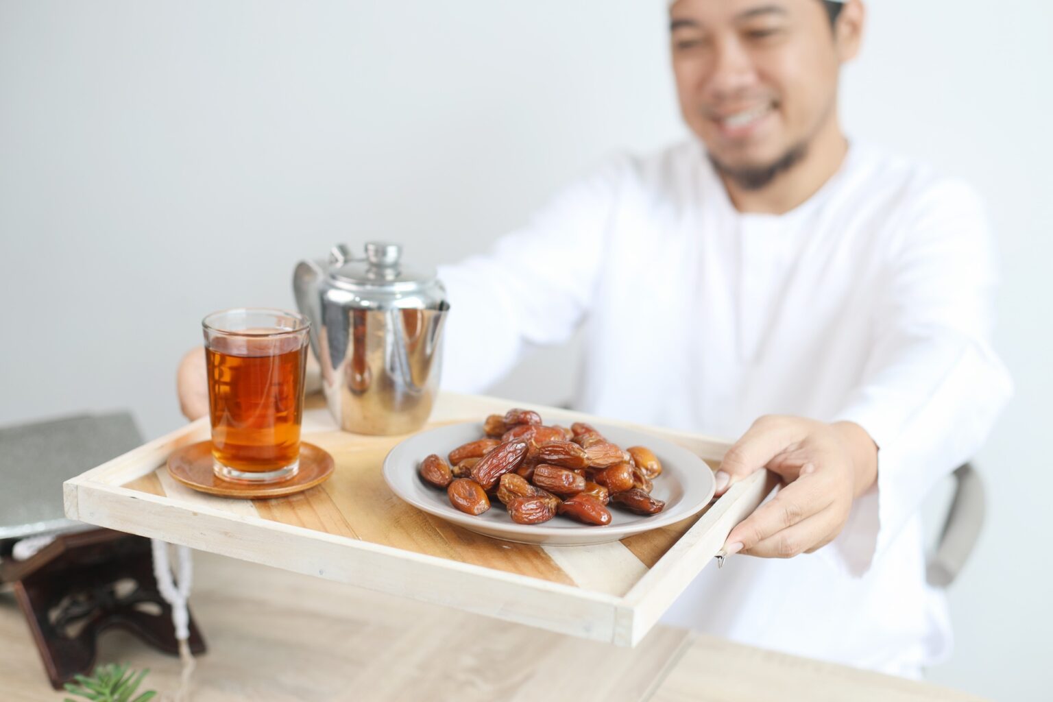 Muslim Man Serving Iftar Food and Drink