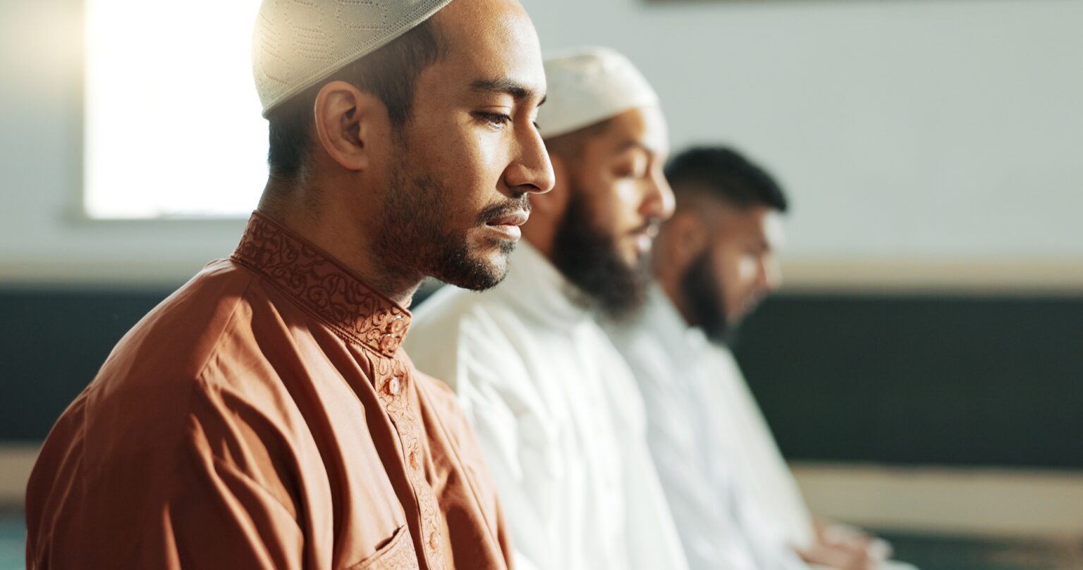 Islamic, praying and men in a Mosque for spiritual religion together as a group to worship Allah in